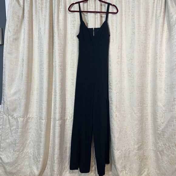 Bebe Jumpsuit Black Wide Split Leg V-Neck Stretch Peek a boo Back Women's Size 8 - Picture 1 of 7